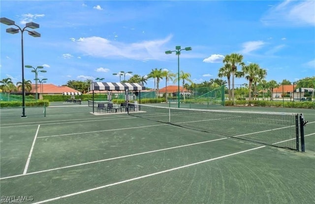 view of tennis court with fence