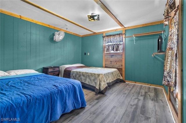 268 Mamie St, Chokoloskee, FL 34138 - bedroom featuring wood walls and wood finished floors