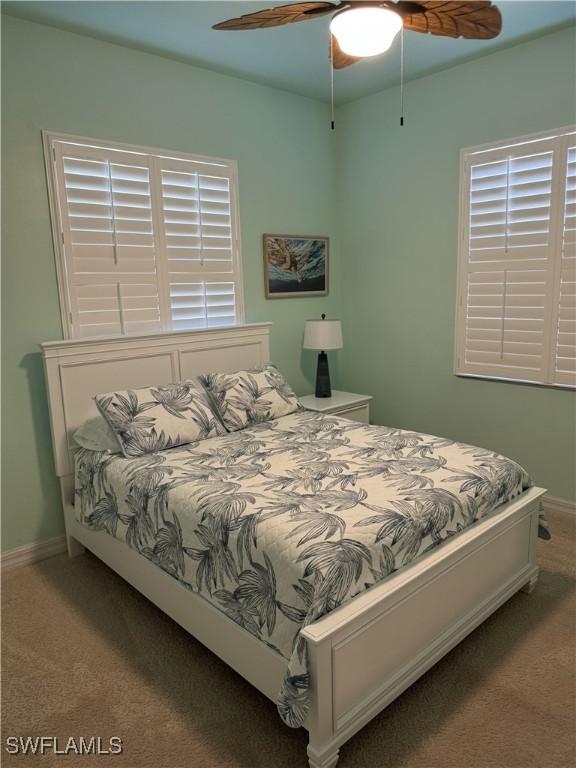 3323 SW 25th Ct, Cape Coral, FL 33914 - bedroom featuring ceiling fan, baseboards, and carpet flooring
