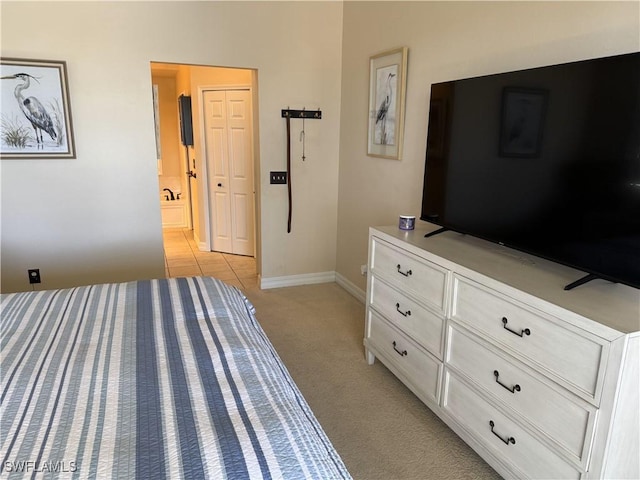 3323 SW 25th Ct, Cape Coral, FL 33914 - bedroom with baseboards and light colored carpet