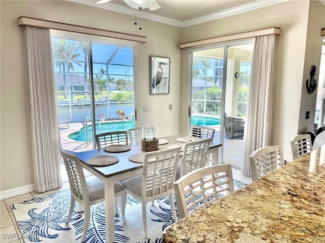 3323 SW 25th Ct, Cape Coral, FL 33914 - dining room featuring a healthy amount of sunlight, crown molding, baseboards, and ceiling fan