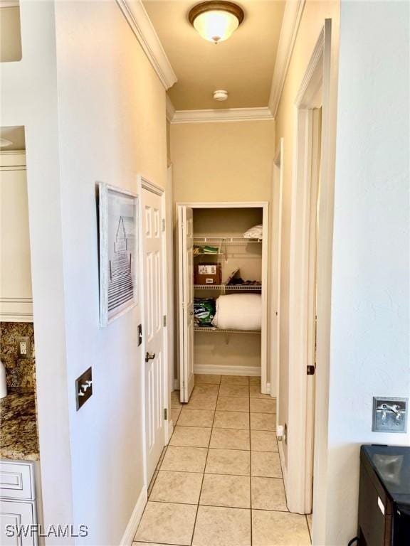 3323 SW 25th Ct, Cape Coral, FL 33914 - hallway featuring ornamental molding and light tile patterned floors