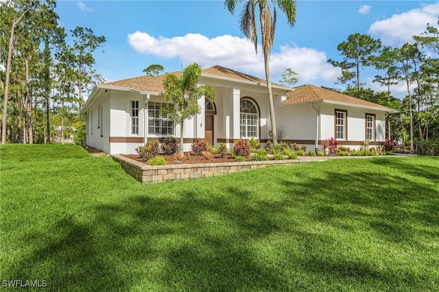 595 31st St NW, Naples, FL 34120 - mediterranean / spanish home with stucco siding and a front yard
