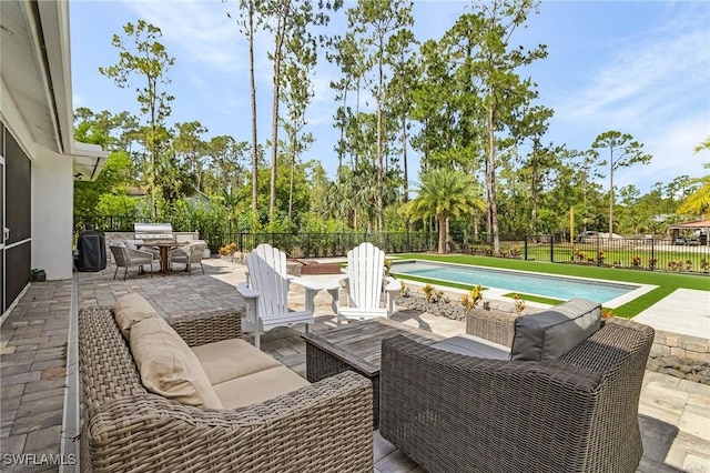 595 31st St NW, Naples, FL 34120 - fenced backyard featuring a patio, outdoor lounge area, and view of wooded area