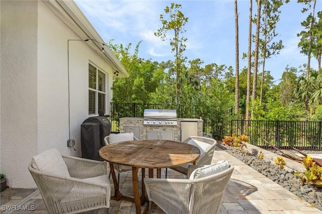 595 31st St NW, Naples, FL 34120 - fenced backyard with outdoor dining space and a patio area