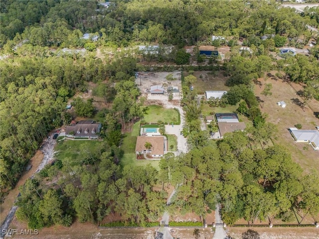 595 31st St NW, Naples, FL 34120 - aerial view of property and surrounding area with a heavily wooded area