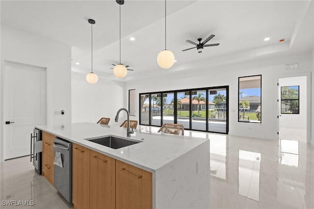 kitchen with open floor plan, a sink, dishwashing machine, modern cabinets, and recessed lighting
