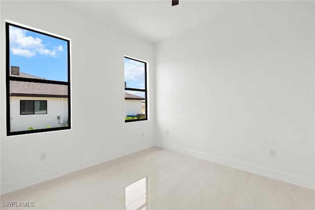 empty room with baseboards