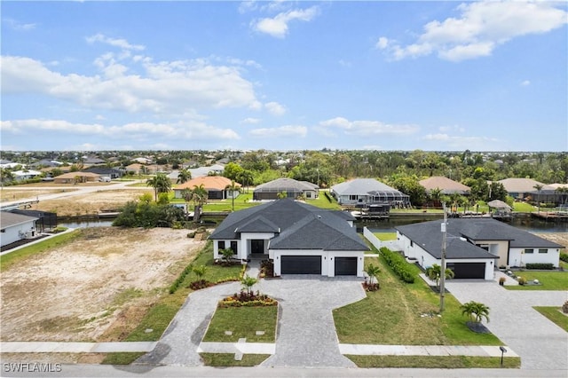 aerial view of residential area with a nearby body of water