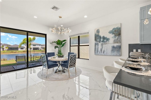 20321 Fair Oak Ln, Estero, FL 33928 - dining space featuring a water view, marble finish floor, an inviting chandelier, visible vents, and recessed lighting