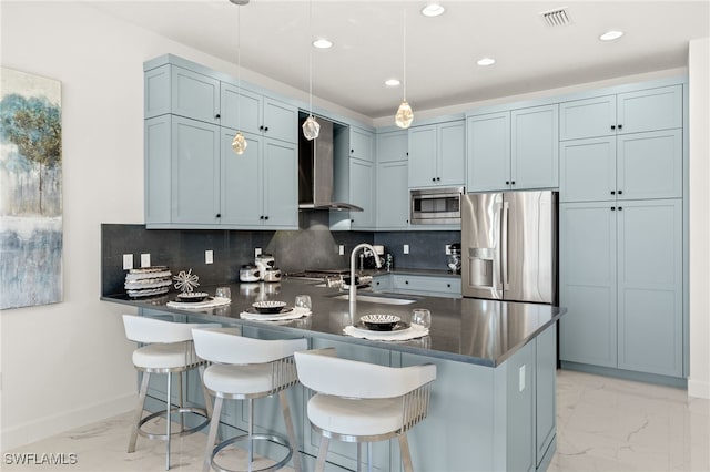 20321 Fair Oak Ln, Estero, FL 33928 - kitchen featuring wall chimney range hood, dark countertops, marble finish floor, appliances with stainless steel finishes, and visible vents