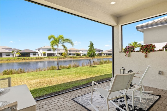 20321 Fair Oak Ln, Estero, FL 33928 - sunroom / solarium featuring a residential view and a water view