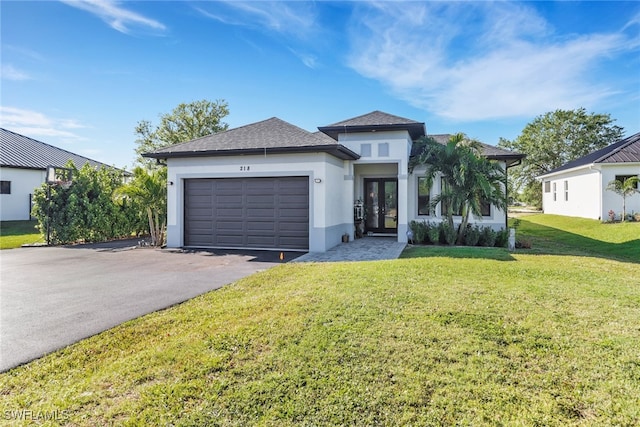 view of front of property with stucco siding, french doors, an attached garage, and aphalt driveway