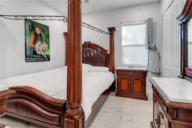 bedroom with marble finish floor