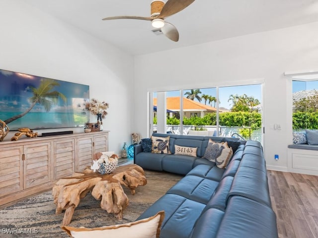 living area with ceiling fan and wood finished floors
