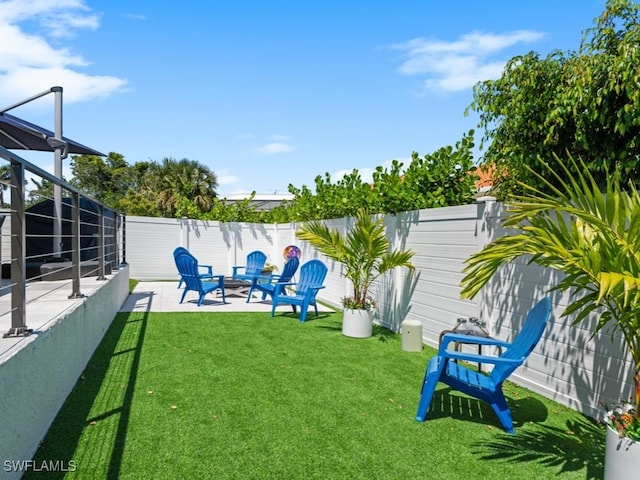 view of yard with a fenced backyard and a patio area