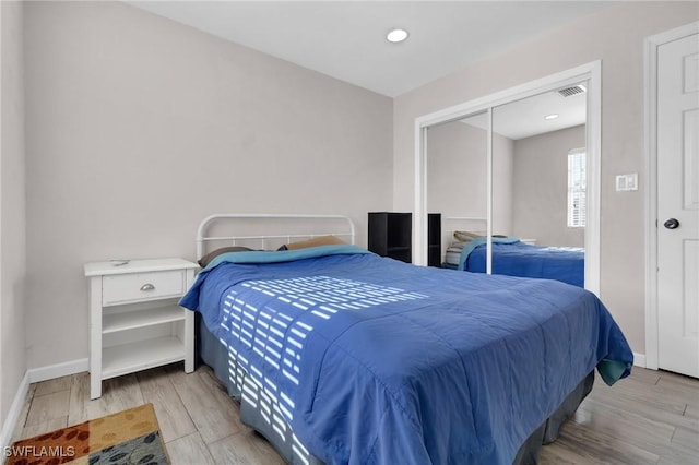 264 Mamie St, Chokoloskee, FL 34138 - bedroom with wood finished floors, a closet, baseboards, and visible vents