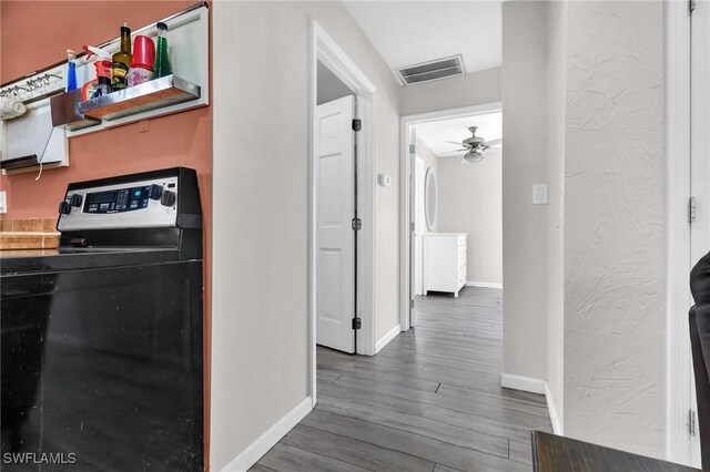 264 Mamie St, Chokoloskee, FL 34138 - hallway featuring baseboards, wood finished floors, and visible vents
