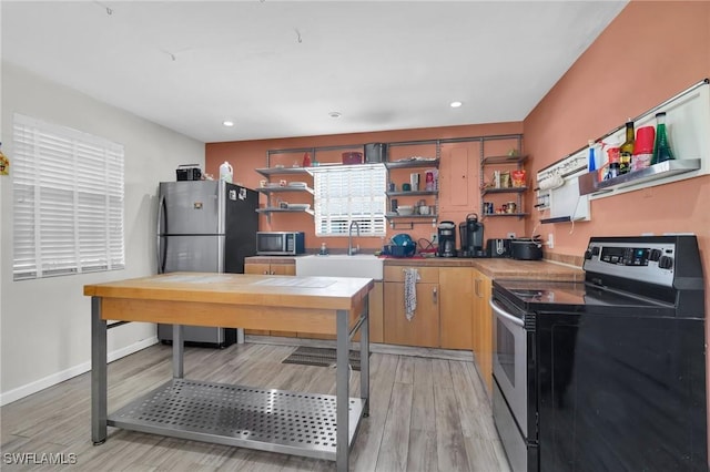 264 Mamie St, Chokoloskee, FL 34138 - office area featuring light wood finished floors, baseboards, a sink, and recessed lighting