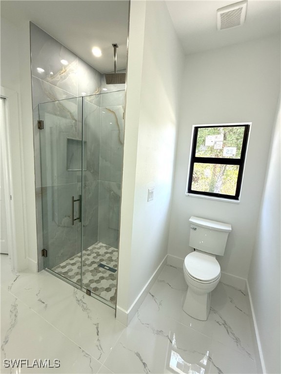 full bath featuring visible vents, baseboards, toilet, a shower stall, and marble finish floor