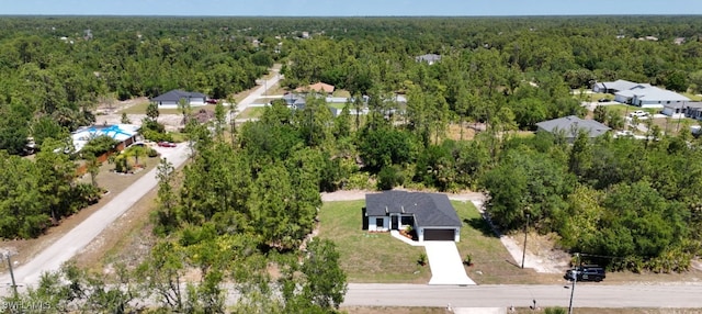 aerial view featuring a view of trees