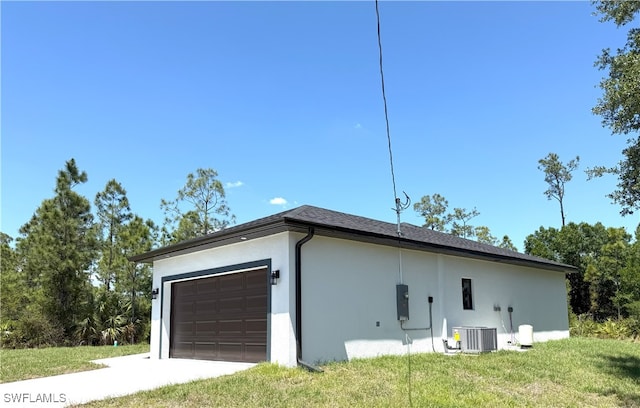 view of property exterior with central AC, a yard, stucco siding, a garage, and concrete driveway