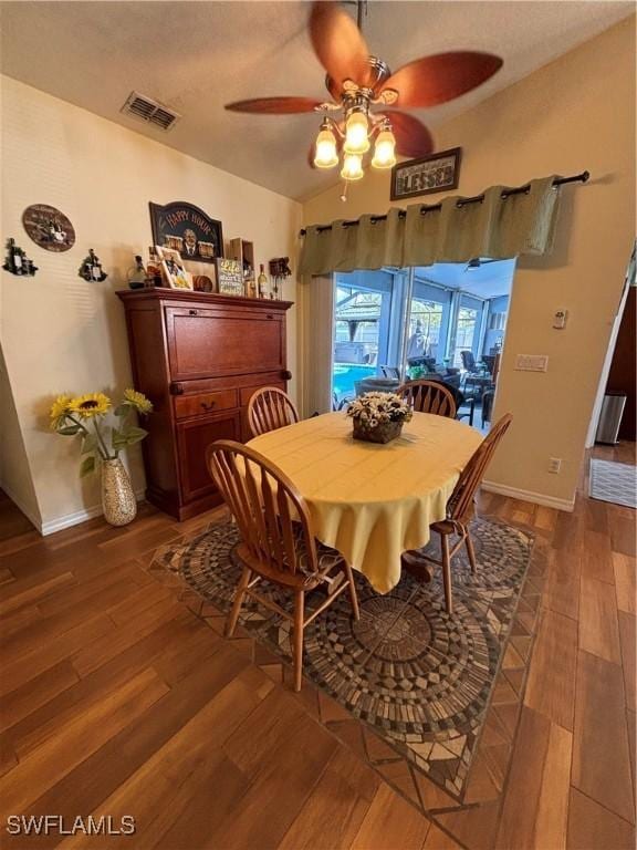 dining space with visible vents, ceiling fan, wood finished floors, and baseboards