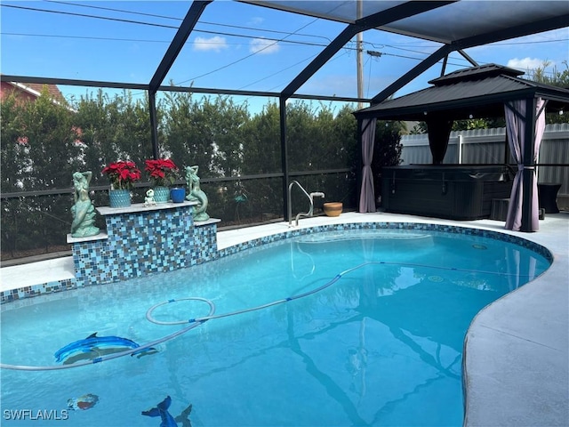 outdoor pool featuring a hot tub, a patio area, a gazebo, fence, and a lanai