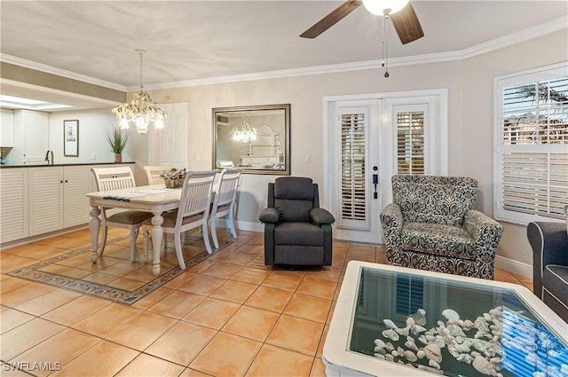 4111 Gunnison Ct Unit 1212, Estero, FL 33928 - dining area with crown molding, ceiling fan with notable chandelier, light tile patterned floors, and baseboards