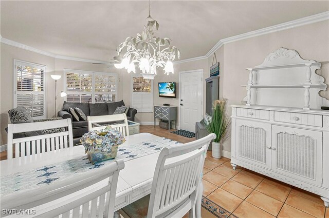 4111 Gunnison Ct Unit 1212, Estero, FL 33928 - dining room with crown molding, light tile patterned flooring, a notable chandelier, and baseboards