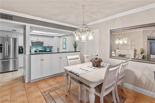 4111 Gunnison Ct Unit 1212, Estero, FL 33928 - dining space with a chandelier, light tile patterned floors, visible vents, and ornamental molding