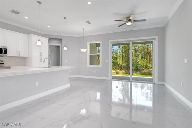 4140 31st Ave NE, Naples, FL 34120 - kitchen with baseboards, range, light countertops, and a sink