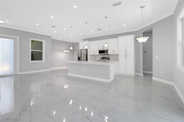 4140 31st Ave NE, Naples, FL 34120 - kitchen featuring white cabinets, stainless steel appliances, baseboards, marble finish floor, and crown molding