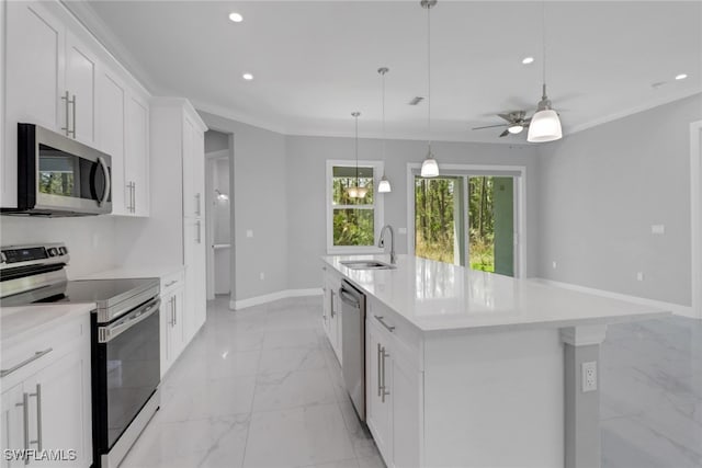 4140 31st Ave NE, Naples, FL 34120 - kitchen with recessed lighting, marble finish floor, stainless steel appliances, light countertops, and baseboards