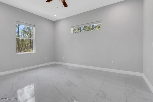 4140 31st Ave NE, Naples, FL 34120 - empty room featuring a ceiling fan, baseboards, recessed lighting, and marble finish floor