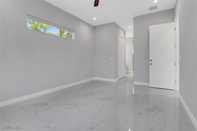 4140 31st Ave NE, Naples, FL 34120 - spare room featuring marble finish floor, baseboards, visible vents, and recessed lighting