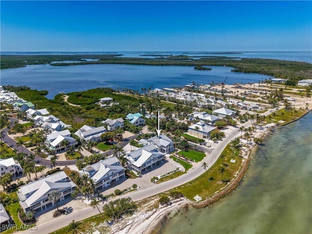 8241 Main St, Bokeelia, FL 33922 - aerial overview of property's location with a nearby body of water and nearby suburban area