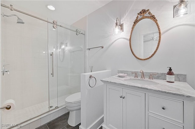 8241 Main St, Bokeelia, FL 33922 - bathroom with vanity, a shower stall, toilet, and tile patterned flooring