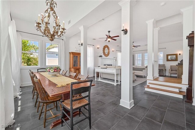 8241 Main St, Bokeelia, FL 33922 - dining area featuring a ceiling fan, decorative columns, healthy amount of natural light, and a chandelier