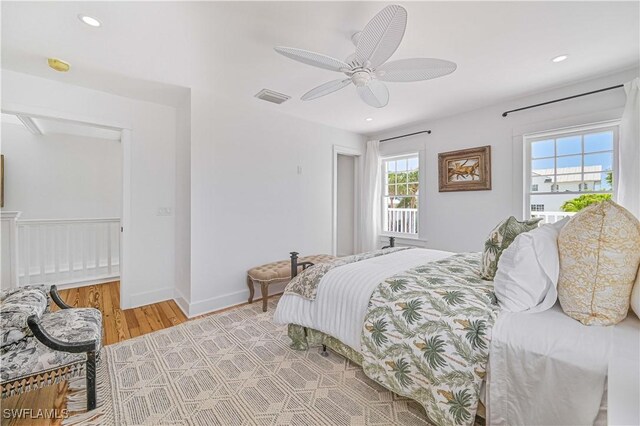 8241 Main St, Bokeelia, FL 33922 - bedroom featuring light wood-type flooring, recessed lighting, a ceiling fan, and baseboards