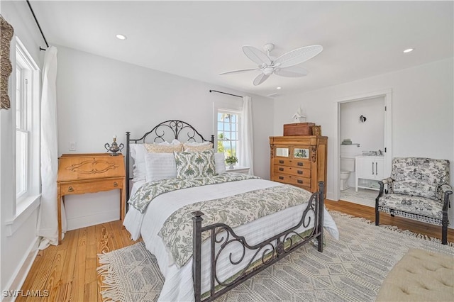 8241 Main St, Bokeelia, FL 33922 - bedroom with light wood-style flooring, a ceiling fan, ensuite bath, and recessed lighting