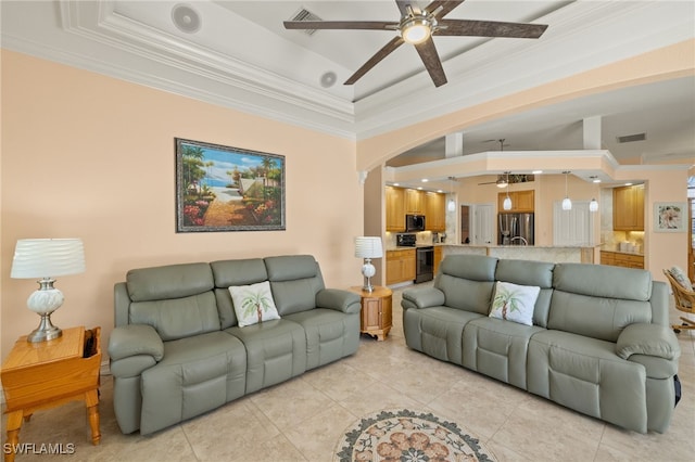 5302 SW 27th Pl, Cape Coral, FL 33914 - living room with ceiling fan, crown molding, light tile patterned floors, arched walkways, and a tray ceiling