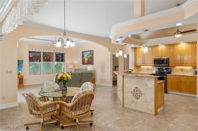 5302 SW 27th Pl, Cape Coral, FL 33914 - dining space with a chandelier, ornamental molding, arched walkways, light tile patterned floors, and a tray ceiling