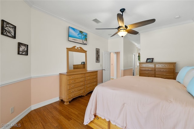 5302 SW 27th Pl, Cape Coral, FL 33914 - bedroom with crown molding, wood finished floors, baseboards, and a ceiling fan