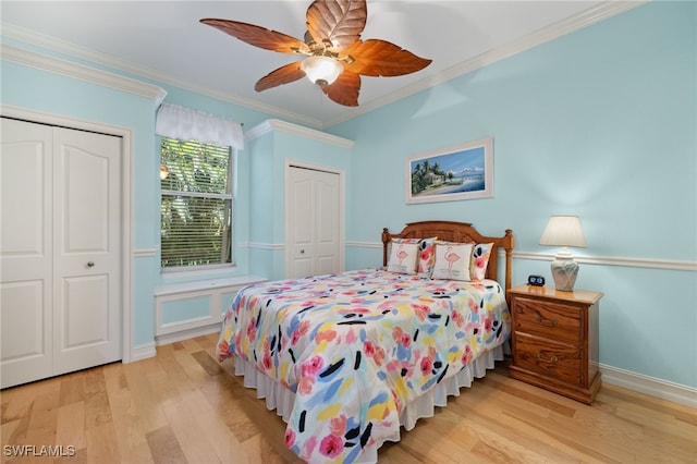 5302 SW 27th Pl, Cape Coral, FL 33914 - bedroom with two closets, light wood-style flooring, ornamental molding, ceiling fan, and baseboards