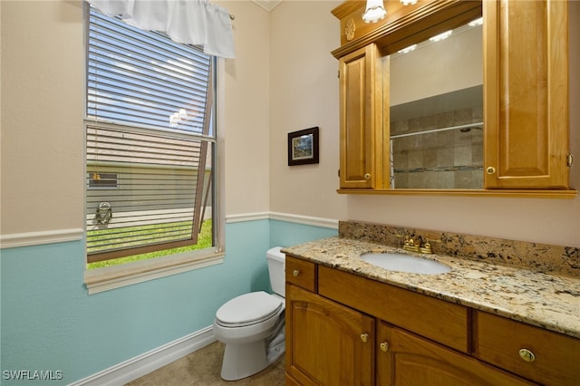 5302 SW 27th Pl, Cape Coral, FL 33914 - bathroom featuring plenty of natural light, vanity, toilet, and baseboards