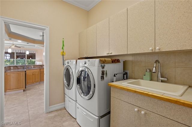 5302 SW 27th Pl, Cape Coral, FL 33914 - laundry room with cabinet space, crown molding, washer and clothes dryer, light tile patterned flooring, and ceiling fan