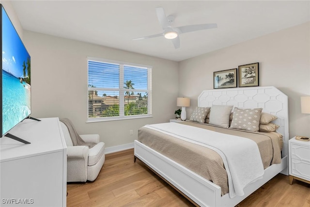 1886 Honduras Ave, Marco Island, FL 34145 - bedroom with ceiling fan, baseboards, and light wood-style flooring