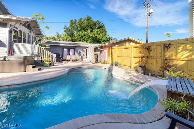 view of swimming pool featuring a fenced in pool, a fenced backyard, a storage structure, a patio area, and an outbuilding