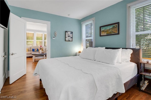 bedroom with wood finished floors
